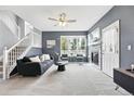 Bright living room with plush carpeting, modern fireplace, and ample natural light at 12411 Irving Dr, Broomfield, CO 80020