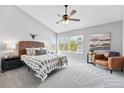 Spacious main bedroom with vaulted ceilings, large windows, and stylish decor at 12411 Irving Dr, Broomfield, CO 80020