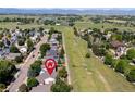A high altitude view of the neighborhood with open space and Rocky Mountain views at 1376 Banner Cir, Erie, CO 80516