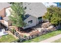 A view of the private backyard with lush landscaping and a concrete patio at 1376 Banner Cir, Erie, CO 80516