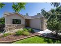 Charming single story home with stone accents, mature trees and a professionally landscaped front yard at 1376 Banner Cir, Erie, CO 80516