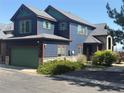 View of two-story home with green garage door and shutters at 2552 W 82Nd Ln # C, Westminster, CO 80031