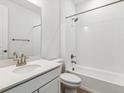 Clean bathroom featuring a shower-tub, white subway tile, and single sink vanity at 564 Penn Rd, Elizabeth, CO 80107