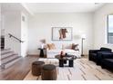 Bright living room featuring modern decor, a neutral color palette, and stylish furnishings at 385 East St, Louisville, CO 80027