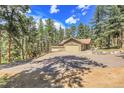 Spacious garage with upper deck, perfect for a workshop or recreational area at 7753 Red Fox Dr, Evergreen, CO 80439