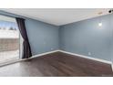 Inviting living room with sliding glass doors opening to the outside at 13993 E Jewell Ave, Aurora, CO 80012