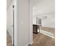 Modern kitchen with wood flooring and stainless steel dishwasher on the island at 21134 E 63Rd Dr, Aurora, CO 80019