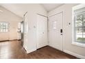 Welcoming foyer with hardwood floors, closet, and a bright window offering natural light at 9713 W Chatfield Ave # H, Littleton, CO 80128