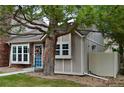 Attractive home showcasing a brick exterior, beautiful landscaping, and a cozy front entrance at 9713 W Chatfield Ave # H, Littleton, CO 80128