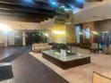 Elegant lobby area with a striking marble fireplace, comfortable seating, and classic decor at 8060 E Girard Ave # 504, Denver, CO 80231