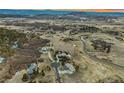 An aerial view shows the neighborhood and landscape in this gorgeous community at 4749 Starfire Cir, Castle Rock, CO 80104