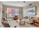 Bright living room with neutral tones, large windows, and stylish furnishings for comfortable living and relaxation at 1975 Grant St # 501, Denver, CO 80203