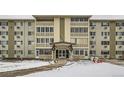 A multi-story building featuring a unique architectural design with multiple windows and a welcoming entrance at 9335 E Center Ave # 4B, Denver, CO 80247