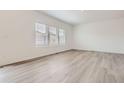 Bright, airy bedroom with modern floors and ample natural light at 15276 Fillmore St, Thornton, CO 80602