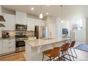 Bright kitchen with stainless steel appliances, granite countertops, and a breakfast bar with seating at 19593 W 93Rd Ln # E, Arvada, CO 80007