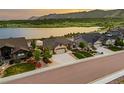 Beautiful home with mountain views, a three-car garage, and a well-maintained lawn with mature trees at 2891 Waterfront Dr, Monument, CO 80132