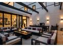 Enjoy outdoor relaxation in this private patio featuring a fire pit, seating area, and dining space at 562 Steele St, Denver, CO 80206