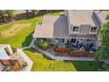 Aerial view of a home with a patio and well maintained backyard at 8780 Chase Dr # 40, Arvada, CO 80003