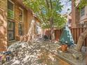 Relaxing patio area with brickwork, outdoor seating, and mature trees for shade at 1011 N Pennsylvania St # H, Denver, CO 80203