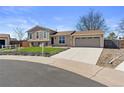 Charming two-story home with beautiful landscaping and an attached two-car garage at 1853 S Zeno Way, Aurora, CO 80017