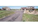 Spacious property featuring a well-maintained driveway and a large barn, perfect for storage at 4075 Merada Ct, Franktown, CO 80116