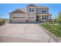 Charming two-story home featuring a three-car garage, stone accents, and well-maintained landscaping at 5929 Echo Hollow St, Castle Rock, CO 80104