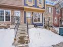 Attractive townhome exterior, snow-covered yard at 2687 E Nichols Cir, Centennial, CO 80122