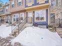 Townhome exterior; tan and blue with stone accents at 2687 E Nichols Cir, Centennial, CO 80122