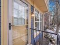 Townhome entrance with glass door and light fixture at 2687 E Nichols Cir, Centennial, CO 80122