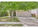 Charming home featuring a two-car garage, mature trees, and a well-maintained lawn at 4081 Odessa St, Denver, CO 80249