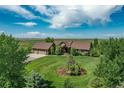 Two-story home on a large lot with attached garage at 69649 E Briarwood Pl, Byers, CO 80103