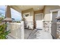 Welcoming front porch with stone accents and a white picket fence at 10109 Yampa St, Commerce City, CO 80022