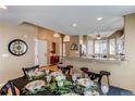Elegant dining space open to the foyer and breakfast nook at 3644 Rosewalk Cir, Highlands Ranch, CO 80129