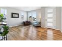 Spacious living room featuring hardwood floors and ample natural light at 9164 Swan River St, Littleton, CO 80125