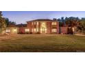 Charming brick residence boasting a large lawn and mature trees at 11345 W 38Th Ave, Wheat Ridge, CO 80033