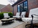 Outdoor patio seating area featuring comfortable chairs and a stylish coffee table at 1315 Grape St, Denver, CO 80220