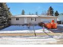 Ranch style home with a 2-car attached garage and spacious yard at 6441 S Eudora Way, Centennial, CO 80121