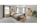 Cozy bedroom with a comfortable bed, neutral tones, and ample natural light at 840 Leeward St, Lochbuie, CO 80603