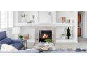 Cozy living room featuring a fireplace with decorative mantel, creating a warm and inviting atmosphere at 1415 N Washington St # 303, Denver, CO 80203