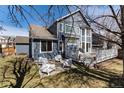 Spacious backyard featuring a large deck with outdoor seating, ideal for entertaining and relaxation at 11722 W Belmont Pl, Littleton, CO 80127