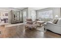 Bright living room with hardwood floors and modern furniture at 2916 Ivanhoe St, Denver, CO 80207