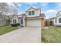 Charming home with a two-car garage, blue front door, and well-maintained lawn at 116 S Lindsey St, Castle Rock, CO 80104