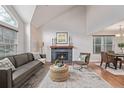 Bright living room with a cozy fireplace, comfortable seating, and wood flooring at 116 S Lindsey St, Castle Rock, CO 80104
