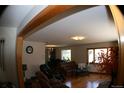 Spacious living room with hardwood floors and ample natural light, perfect for entertaining at 1085 Kingston St, Aurora, CO 80010