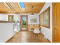 Bright dining nook featuring hardwood floors, a skylight, and a built-in bench at 270 31St St, Boulder, CO 80305