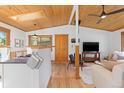 Spacious living area with wood ceilings, a television, and cozy seating arrangement at 270 31St St, Boulder, CO 80305