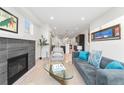 Bright living room features a fireplace and open floor plan at 2468 S Cherokee St, Denver, CO 80223