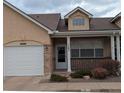Charming home featuring a well-maintained lawn, front porch, and attached garage at 1343 Villa Grv, Monument, CO 80132