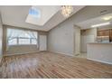 Bright living room features hardwood floors, vaulted ceilings, and an open floor plan at 1343 Villa Grv, Monument, CO 80132
