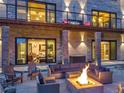 Cozy outdoor patio with fire pit and comfortable seating, perfect for entertaining guests and relaxing in the evenings at 7793 Elk Path Way, Morrison, CO 80465